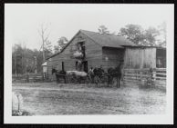 Cotton Wagon in front of Barn